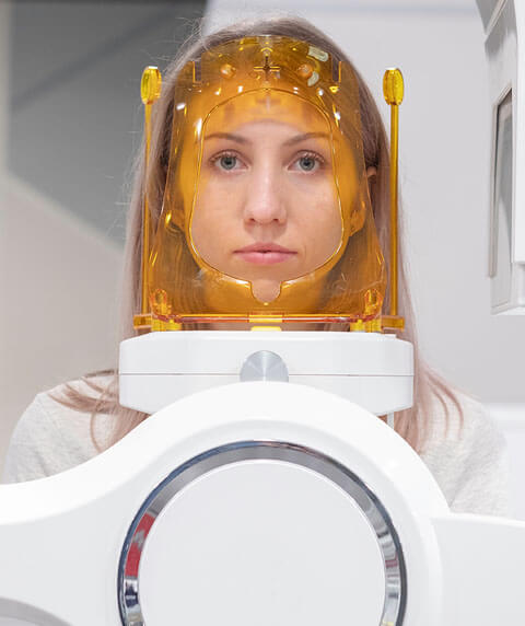 A woman undergoing our Cone beam CT scans.